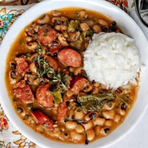 Instant Pot black eyes peas with scoop of white rice in a white bowl.