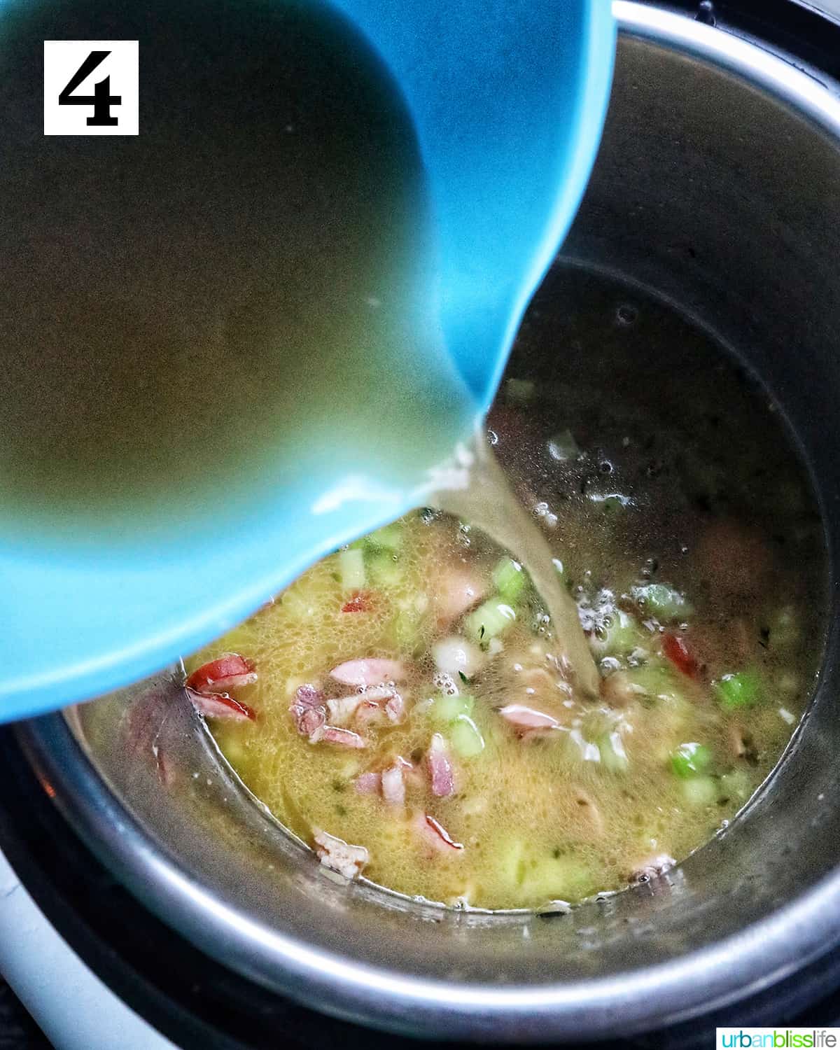 blue bowl pouring chicken broth into the black eyed peas in the instant pot.