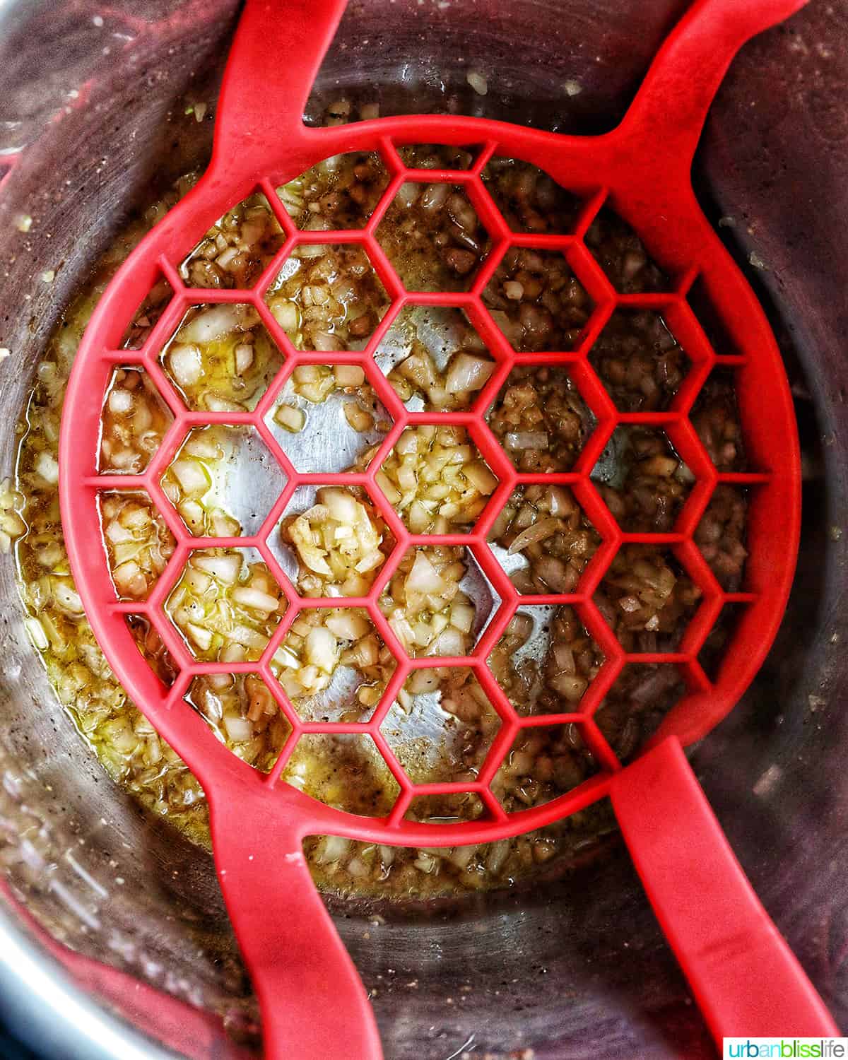 adding a red sling to the Instant Pot.