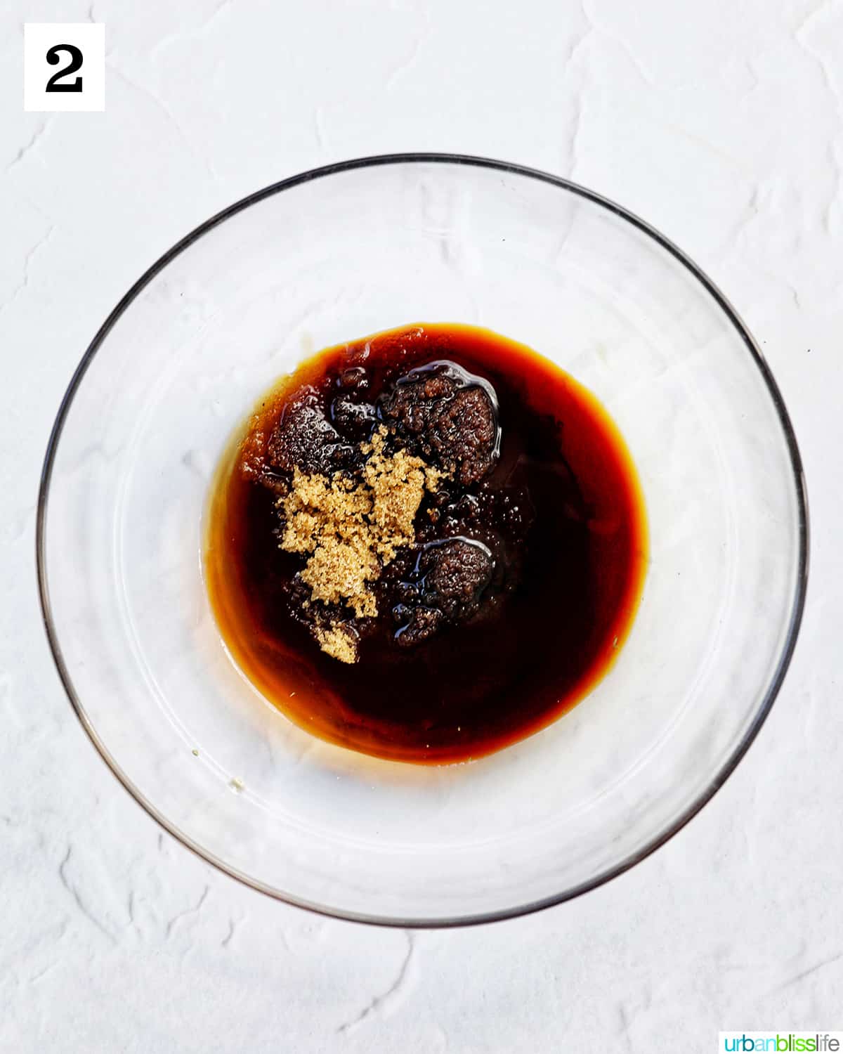 glass bowl of sauce for beef pad see ew.