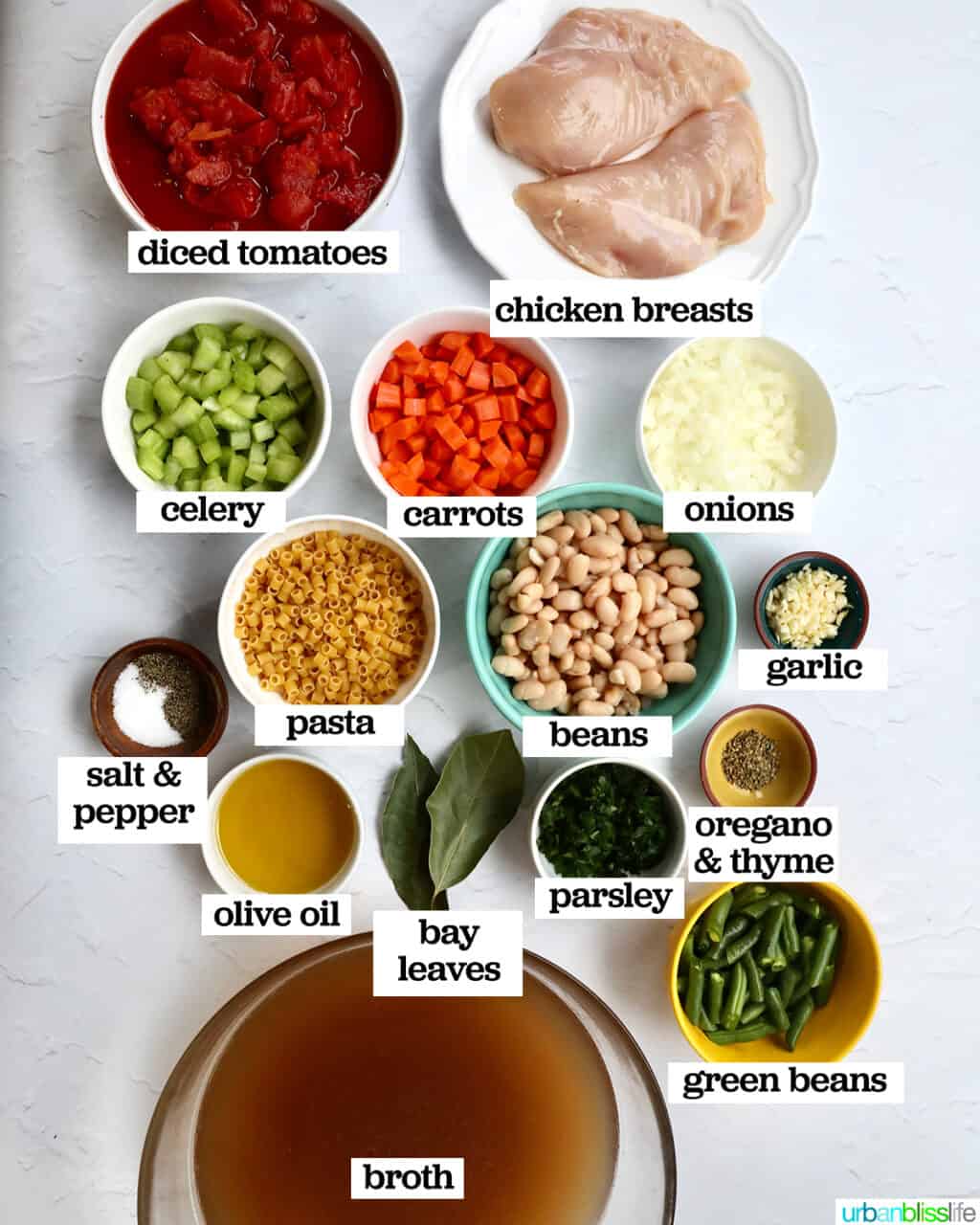 bowls of ingredients to make chicken minestrone soup.