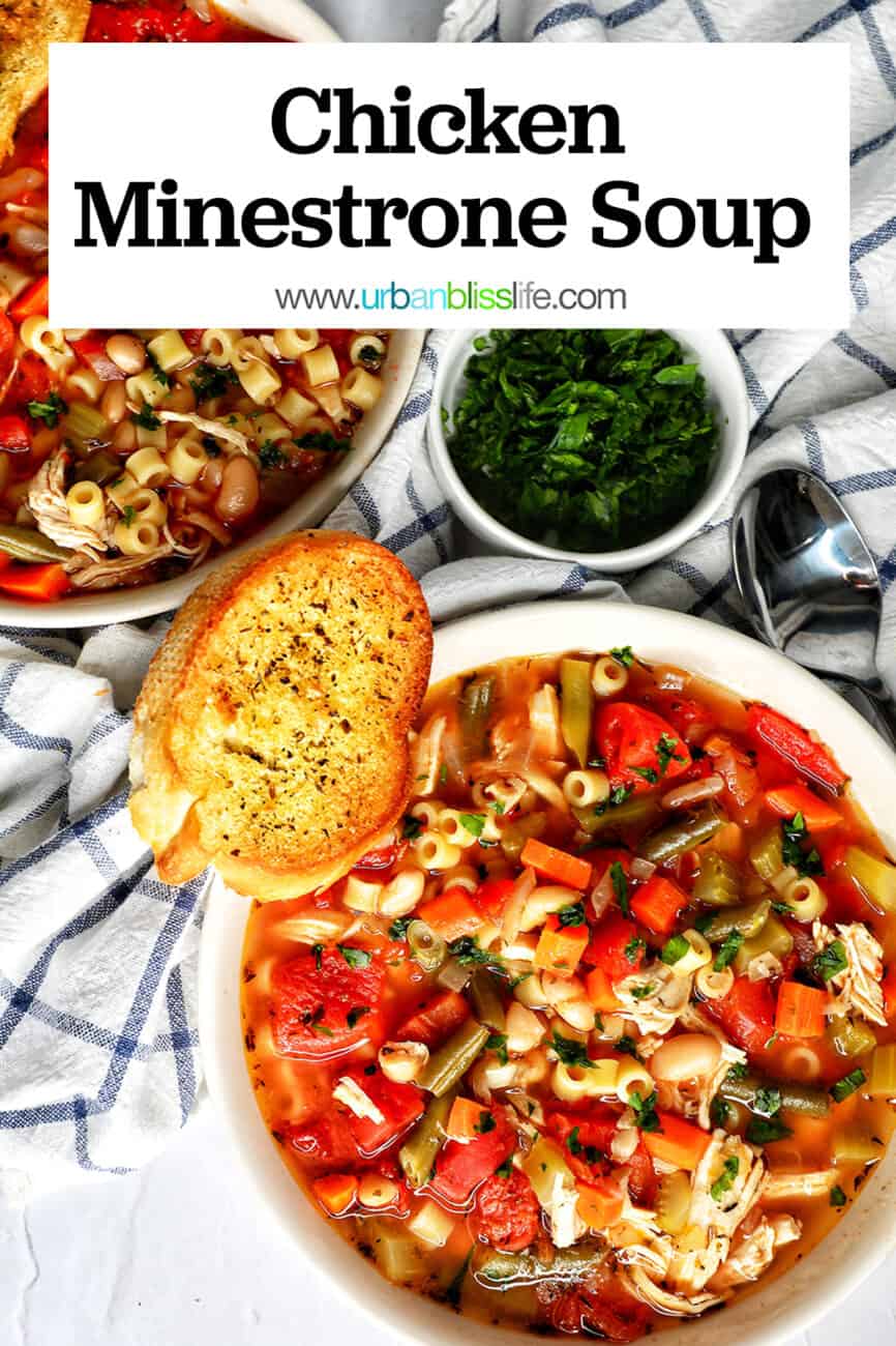 Chicken Minestrone Soup in a white bowl with side of garlic bread with title text overlay.