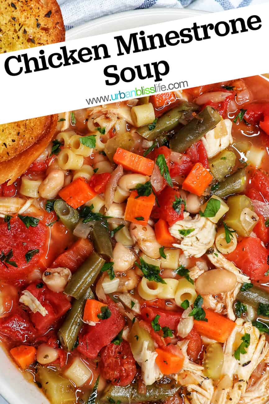 Chicken Minestrone Soup in a white bowl with side of garlic bread with title text overlay.