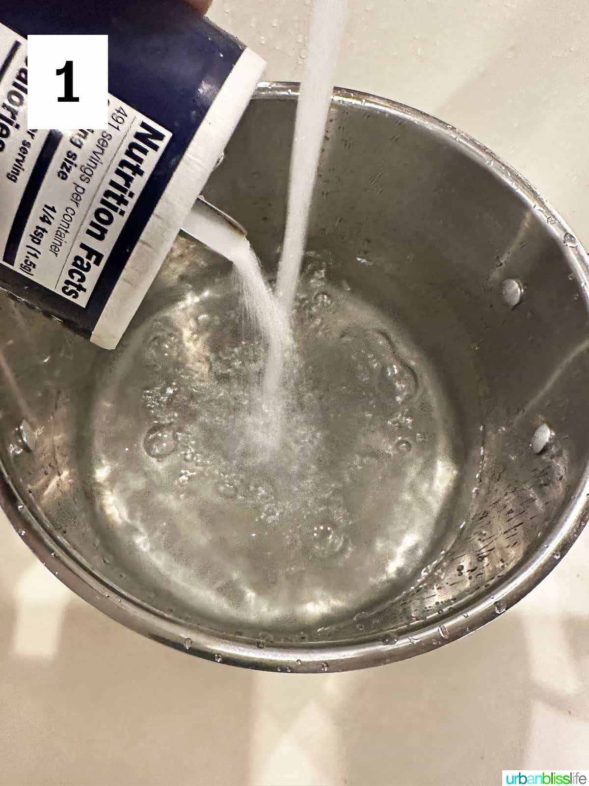 adding salt to a large pot of boiling water.