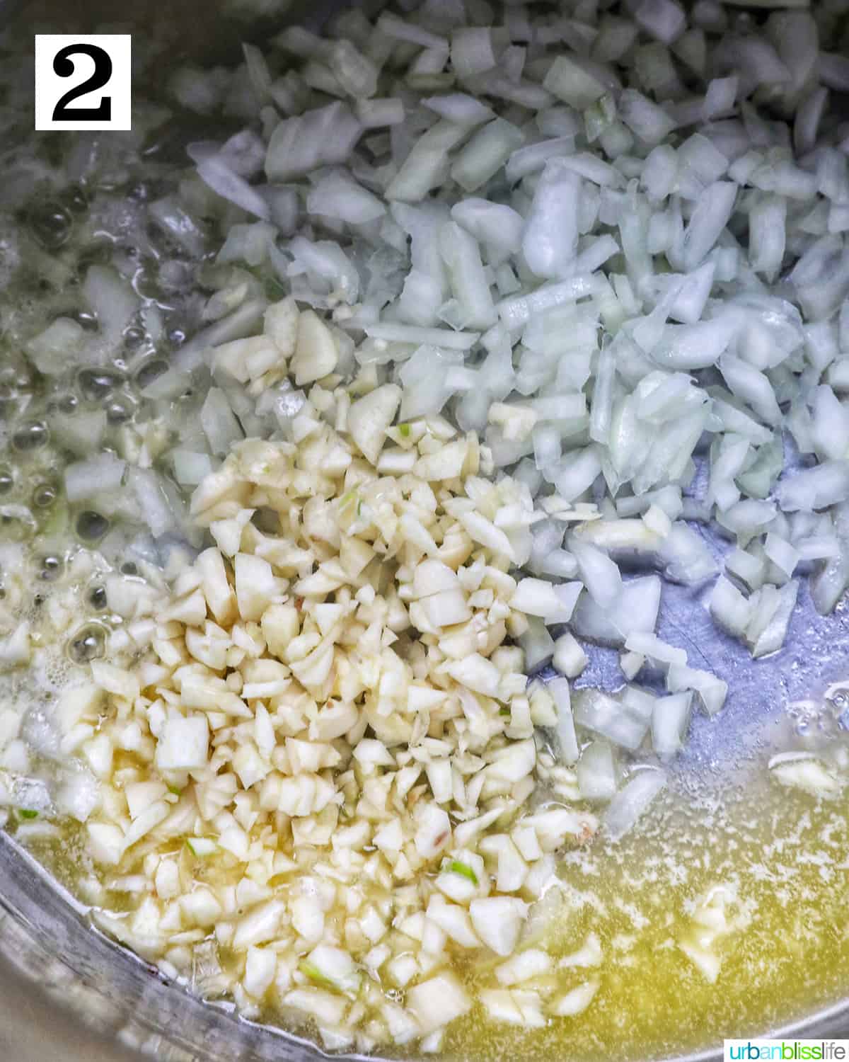 minced garlic and diced onions sauteing in an instant pot.