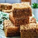 stack of Irish coffee cake on a green plate with green patterned napkins.
