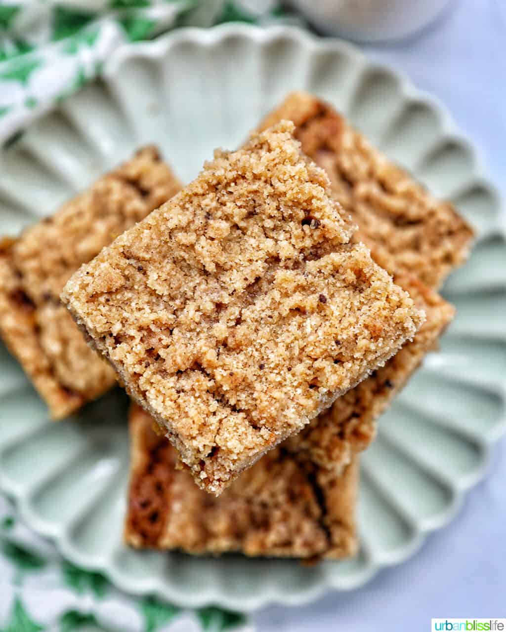 stack of Irish coffee cake on a green plate with green patterned napkins.