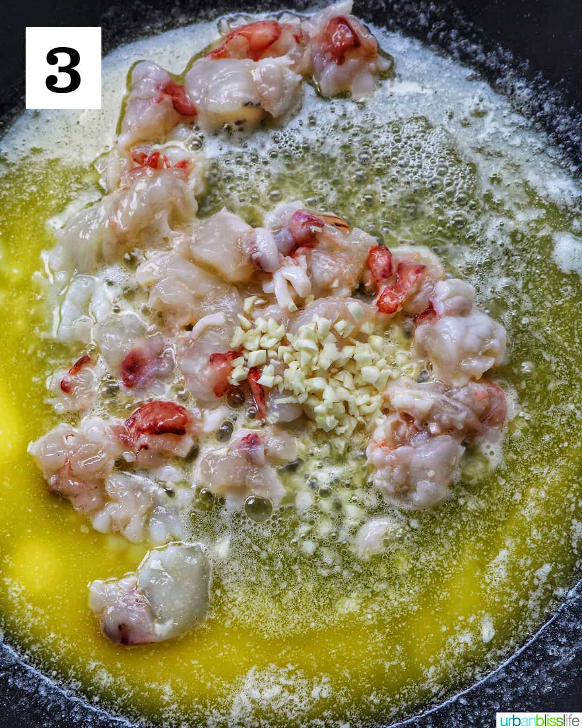 adding garlic to lobster meat and butter in a skillet.
