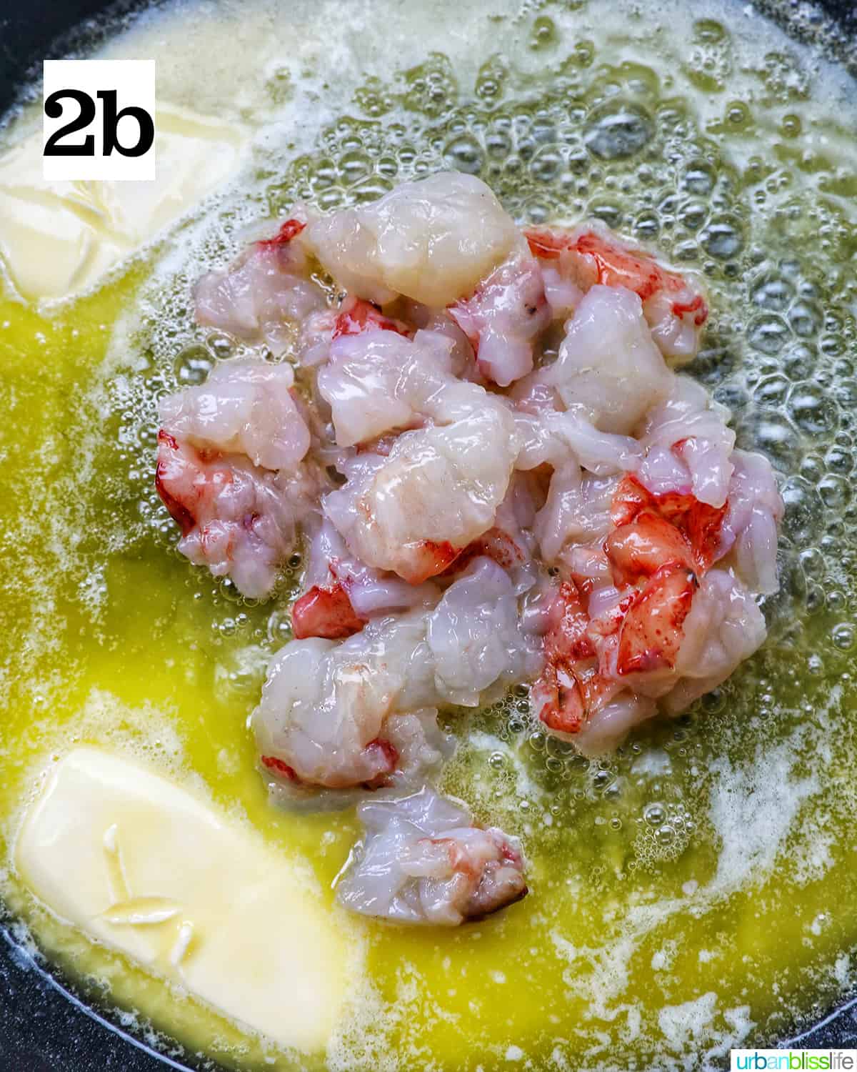 adding lobster meat to butter melting in a skillet.