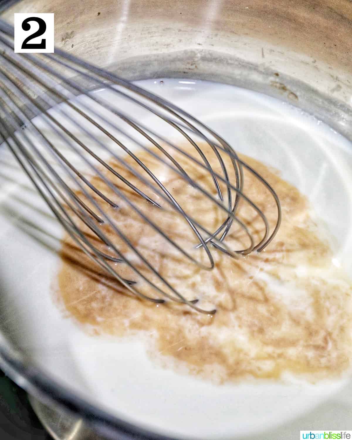 whisking sugar, cream, and vanilla in a saucepan to make ice cream.