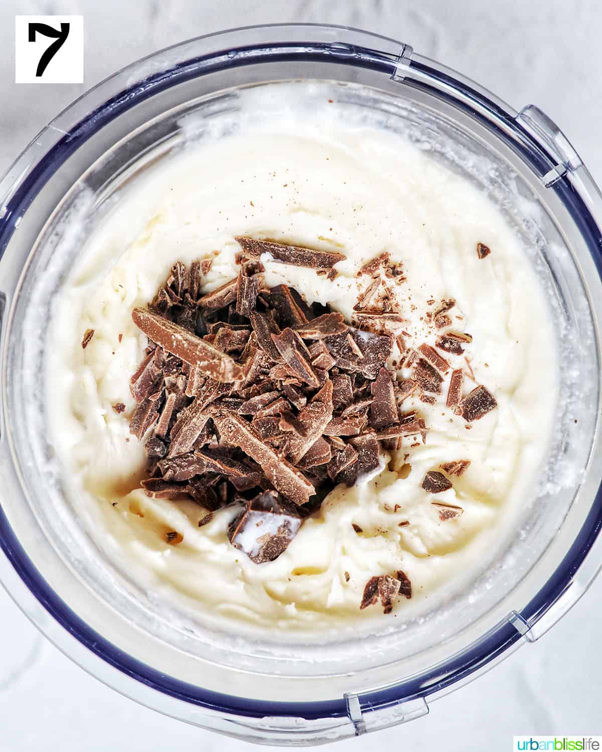 Ninja Creami pint container with stracciatella ice cream and chocolate shavings.