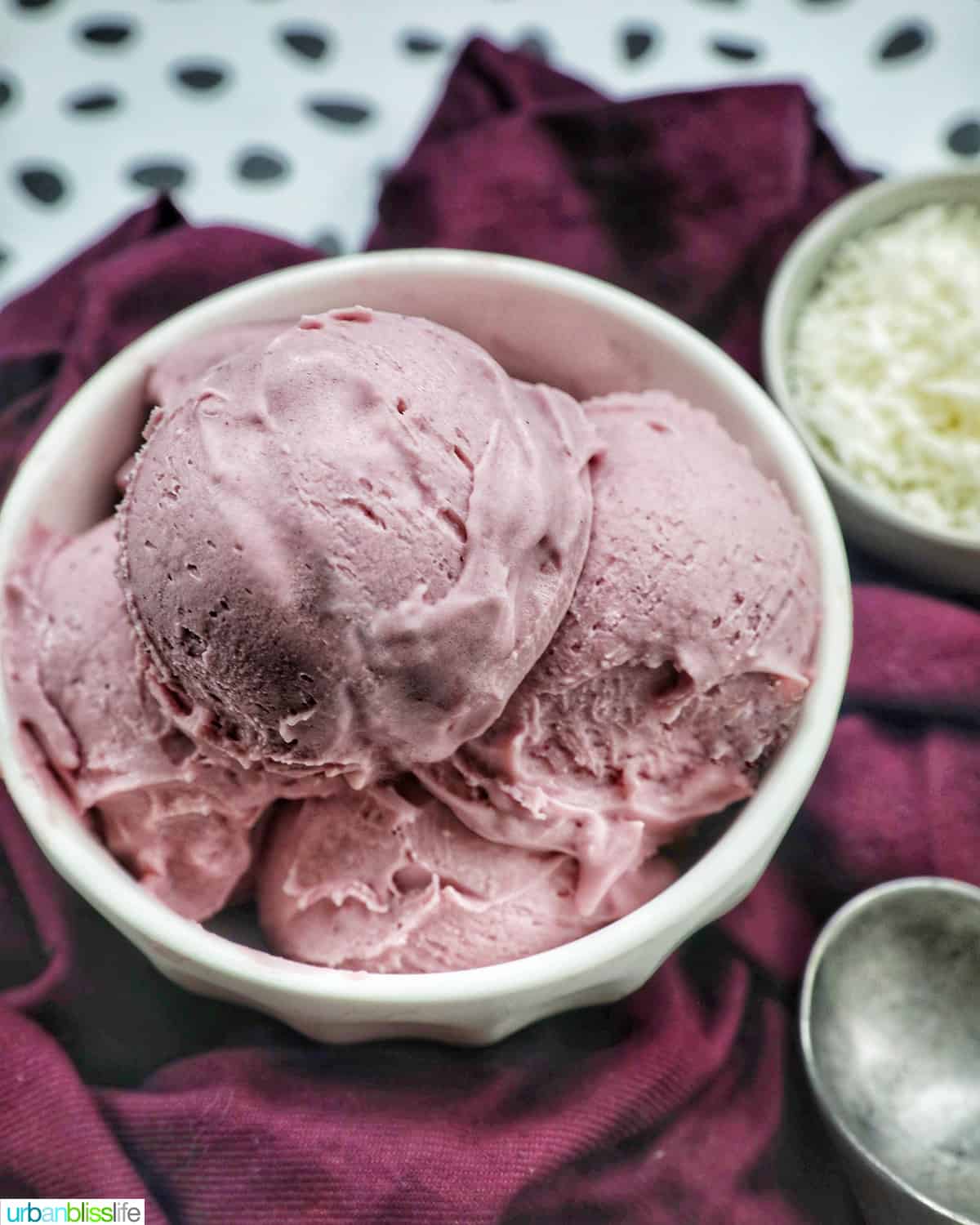 white bowl with scoops of purple ube ice cream.