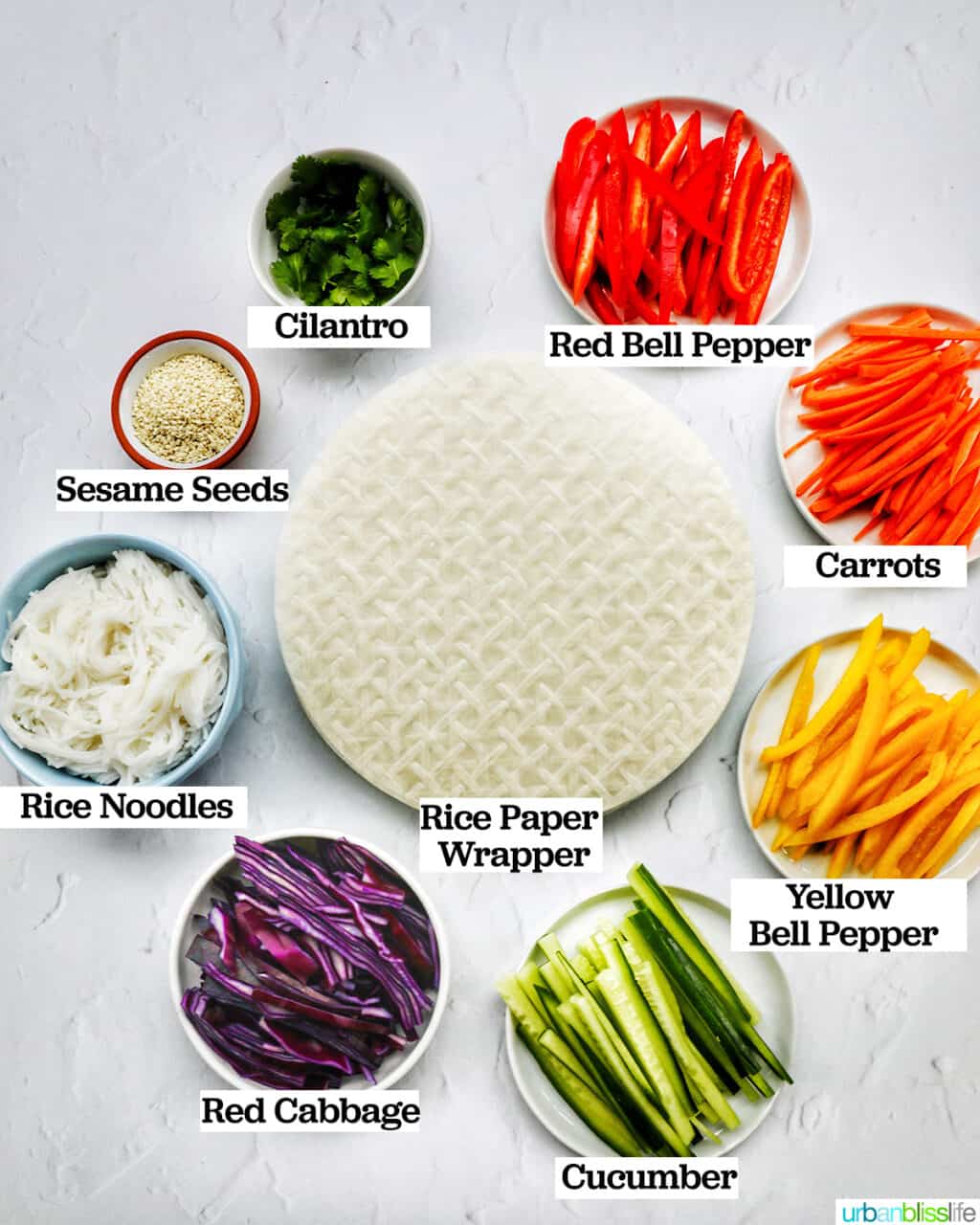 sliced veggies and rice paper rolls to make vegan summer rolls.