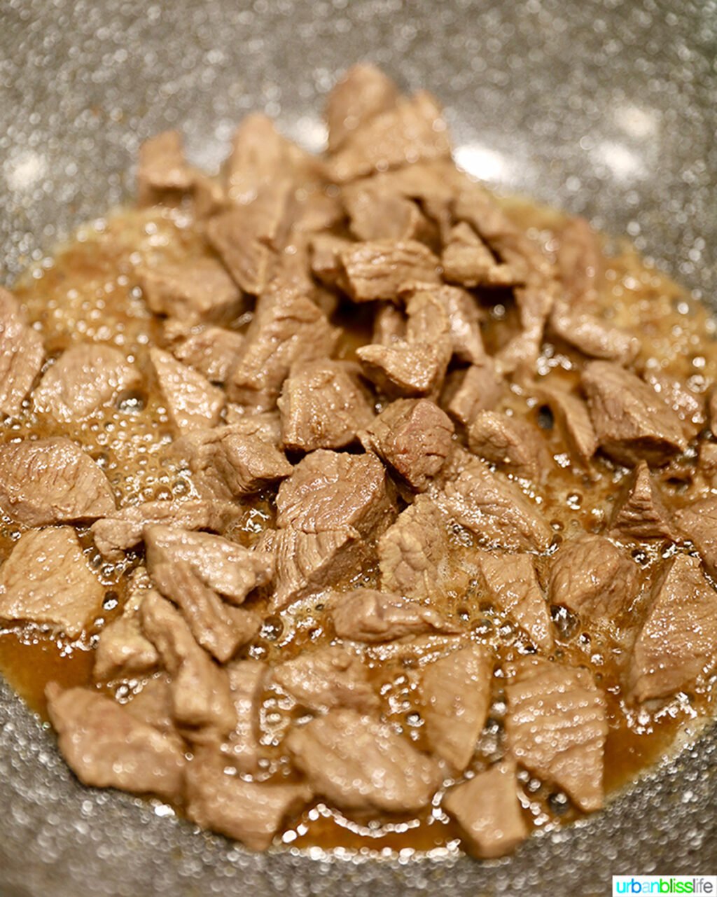 beef for beef lo mein cooking in wok