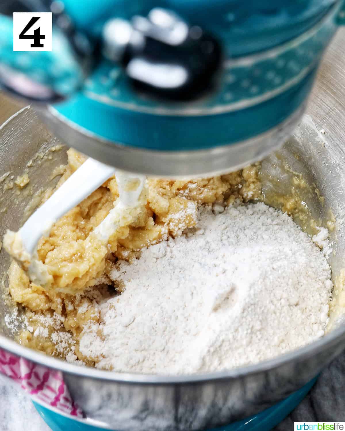 adding dry ingredients to wet ingredients in the stand mixer.