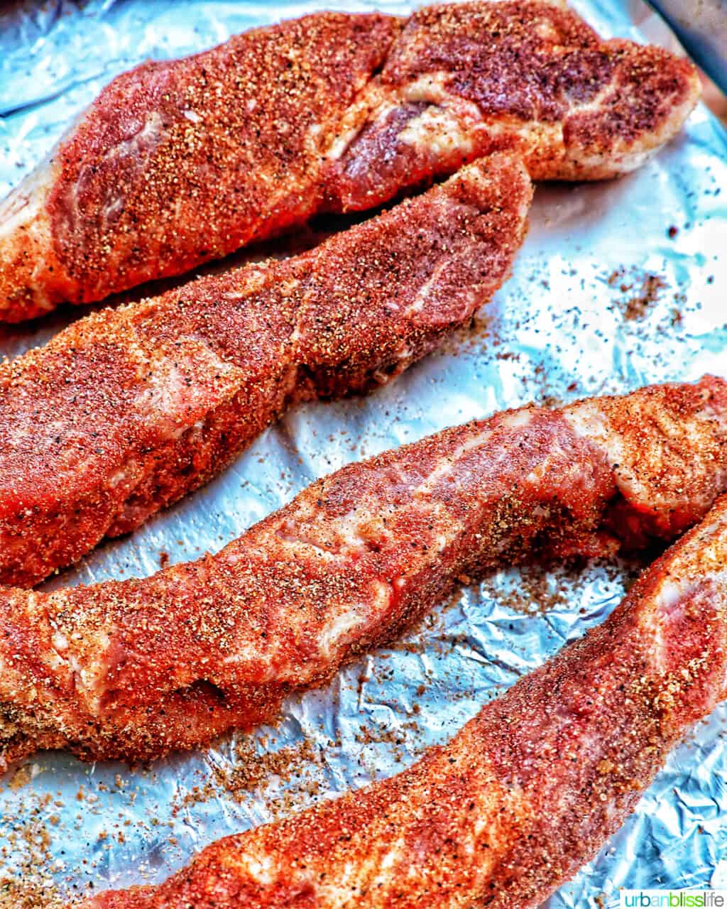 country style ribs seasoned on aluminum foil.