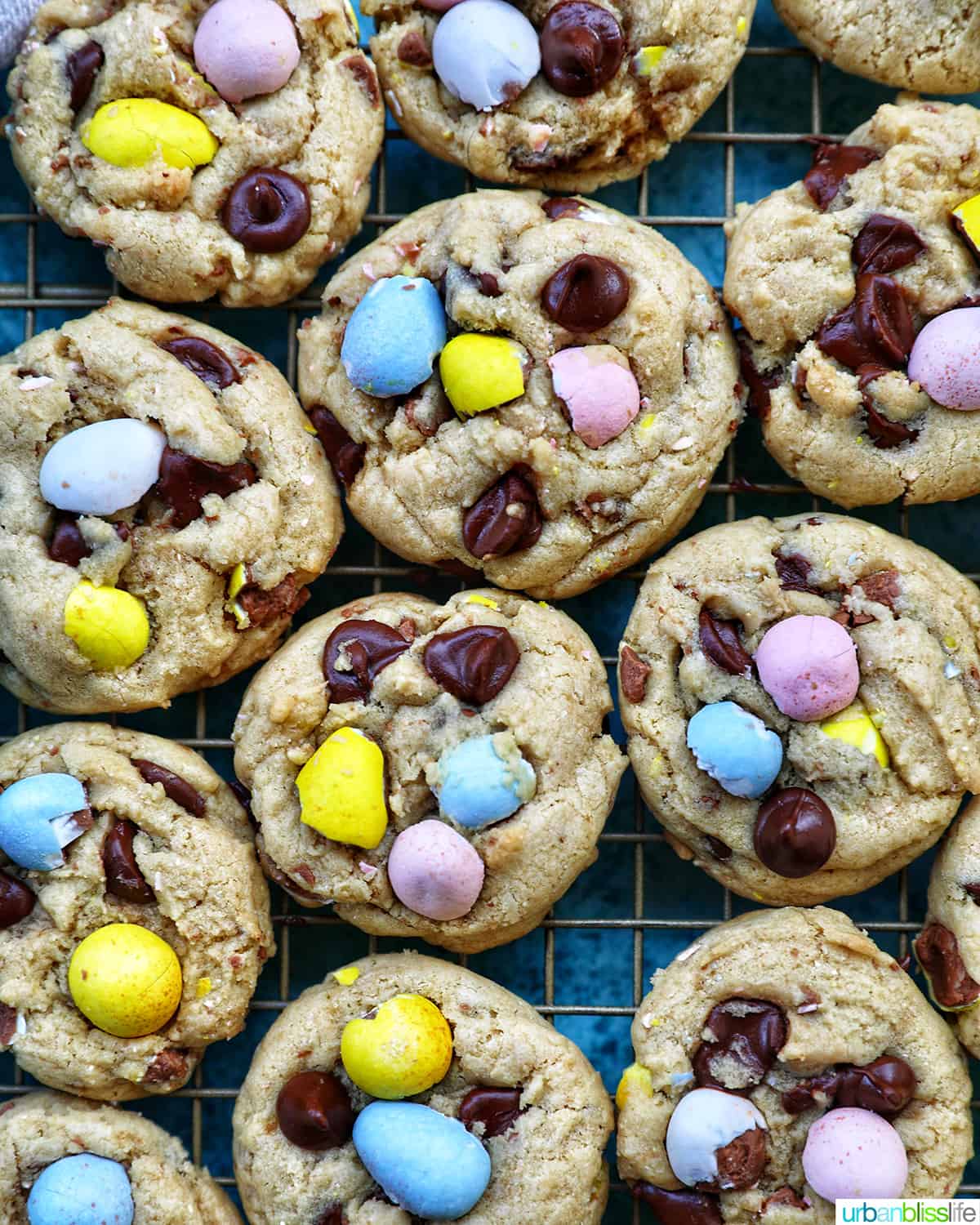 rows of Easter mini egg cookies on a wire rack.