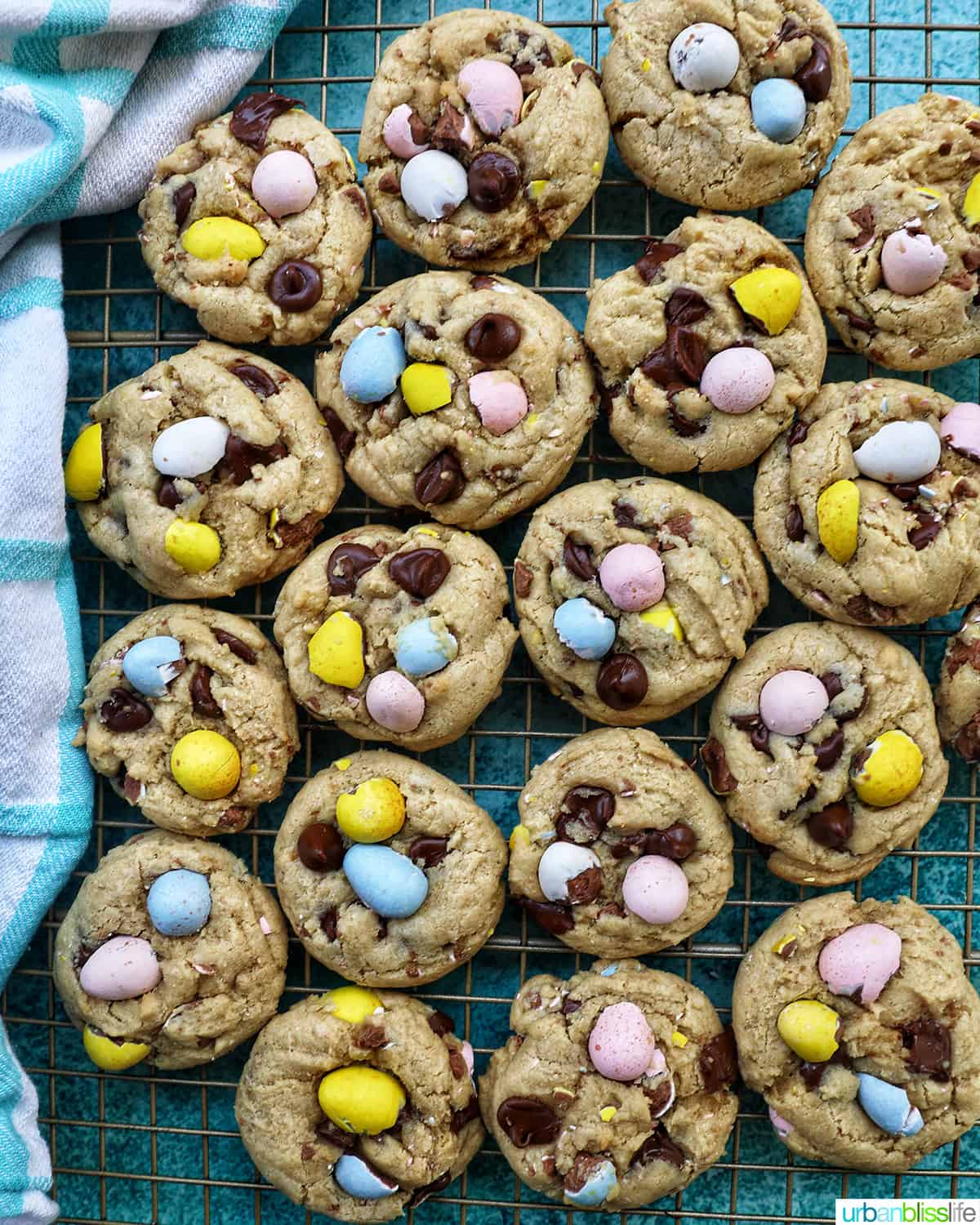 rows of Easter mini egg cookies on a wire rack.