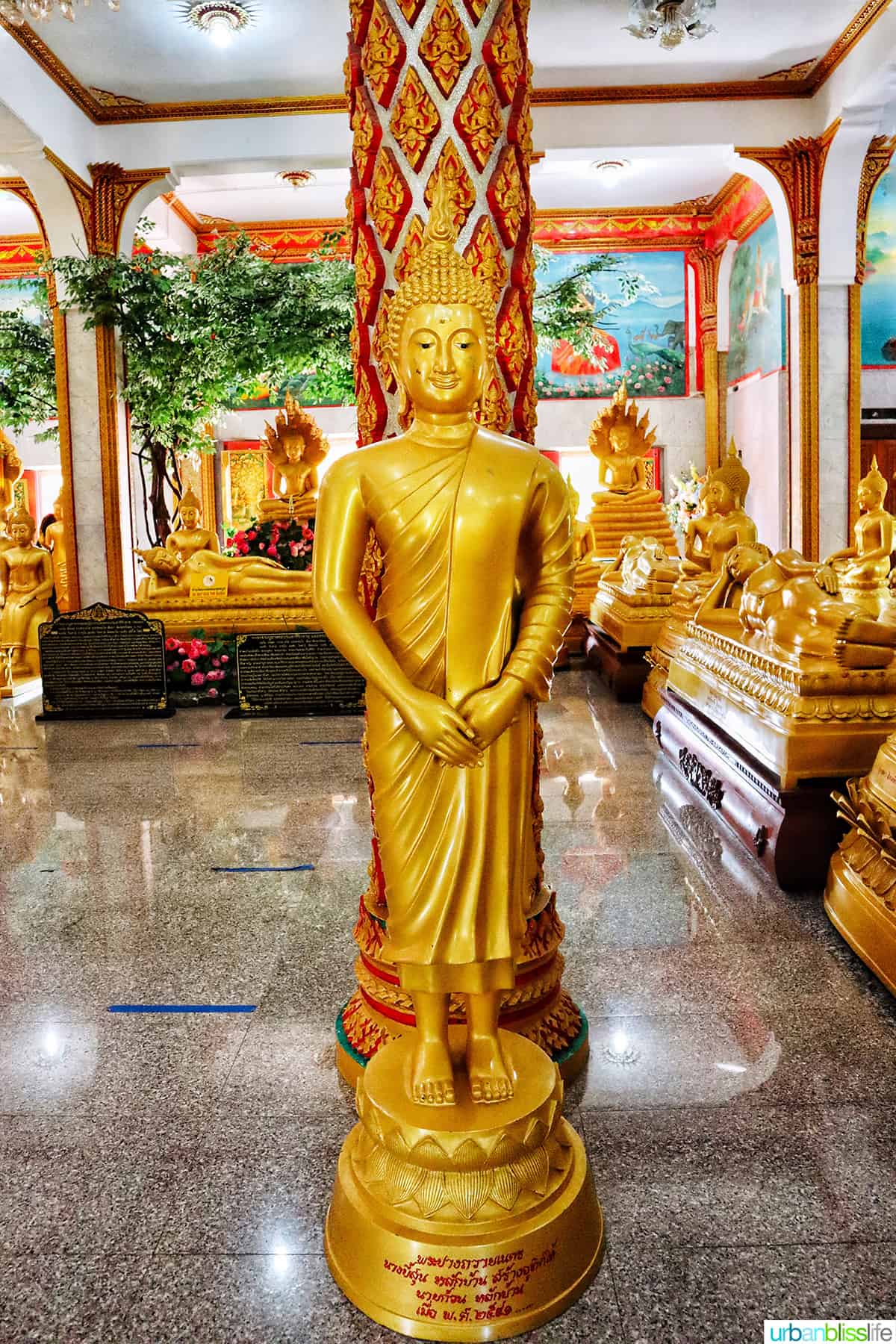 golden buddhas in the Prayer Hall of Wat Chalong Temple in Phuket Thailand.