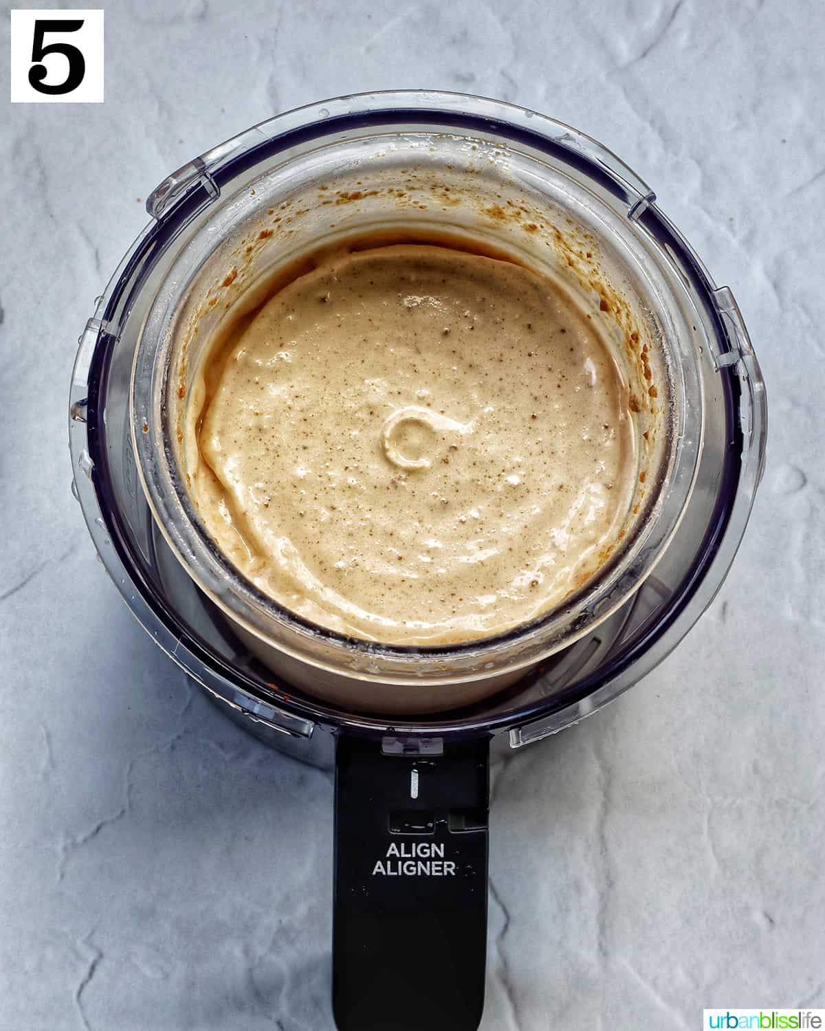 Biscoff milkshake in a Ninja Creami container.
