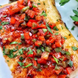 pan seared sea bass with red bell pepper and green bell pepper relish.