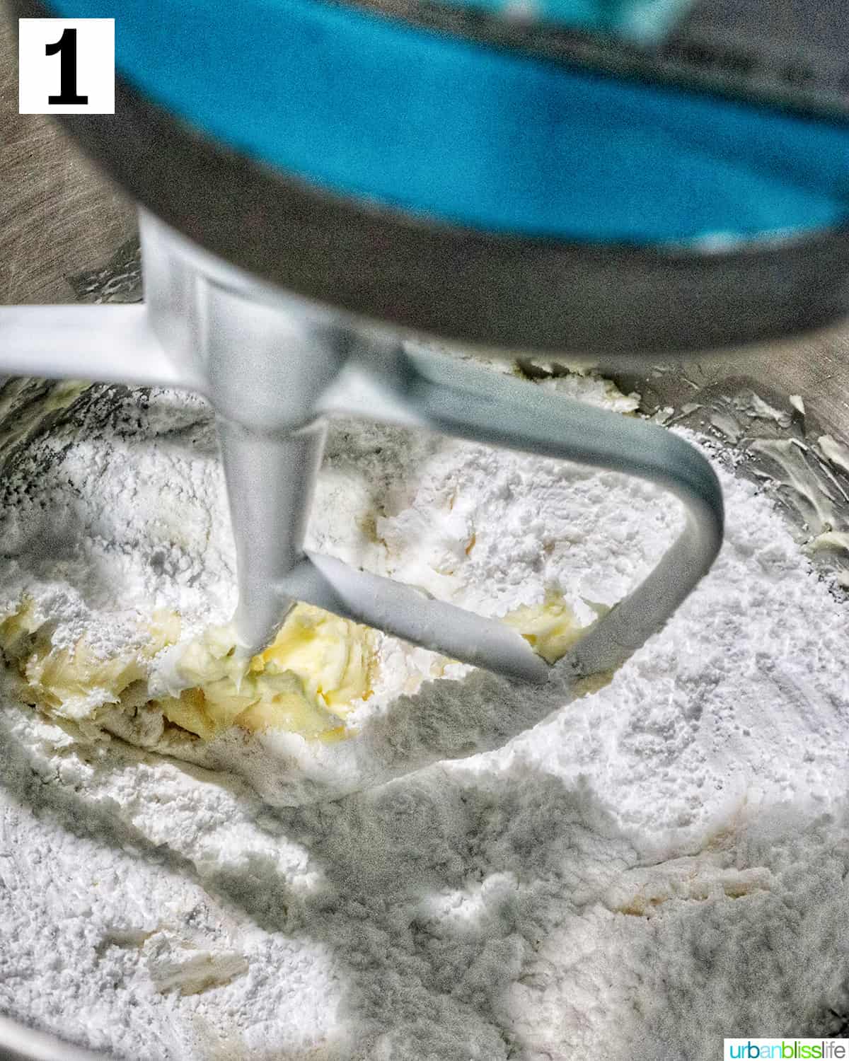 stand mixer with butter and powdered sugar to make buttercream frosting.