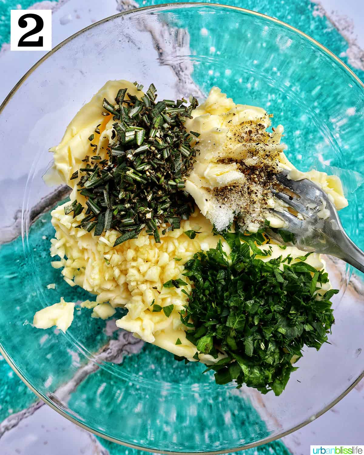 ingredients to make garlic herb compound butter in a bowl.