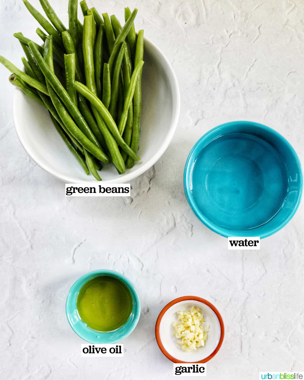 bowls of ingredients to make green beans.