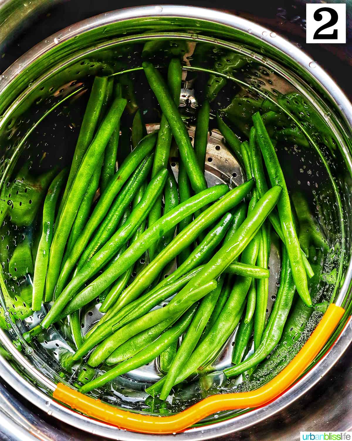 green beans in a steamer basket in the instant pot. 