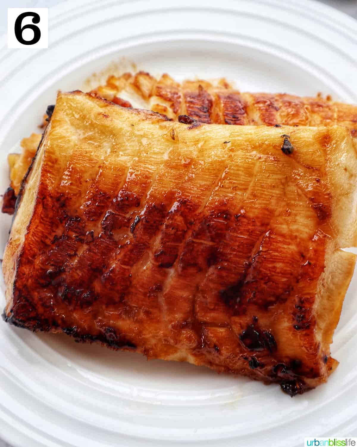 chilean sea bass fillet resting on a plate.