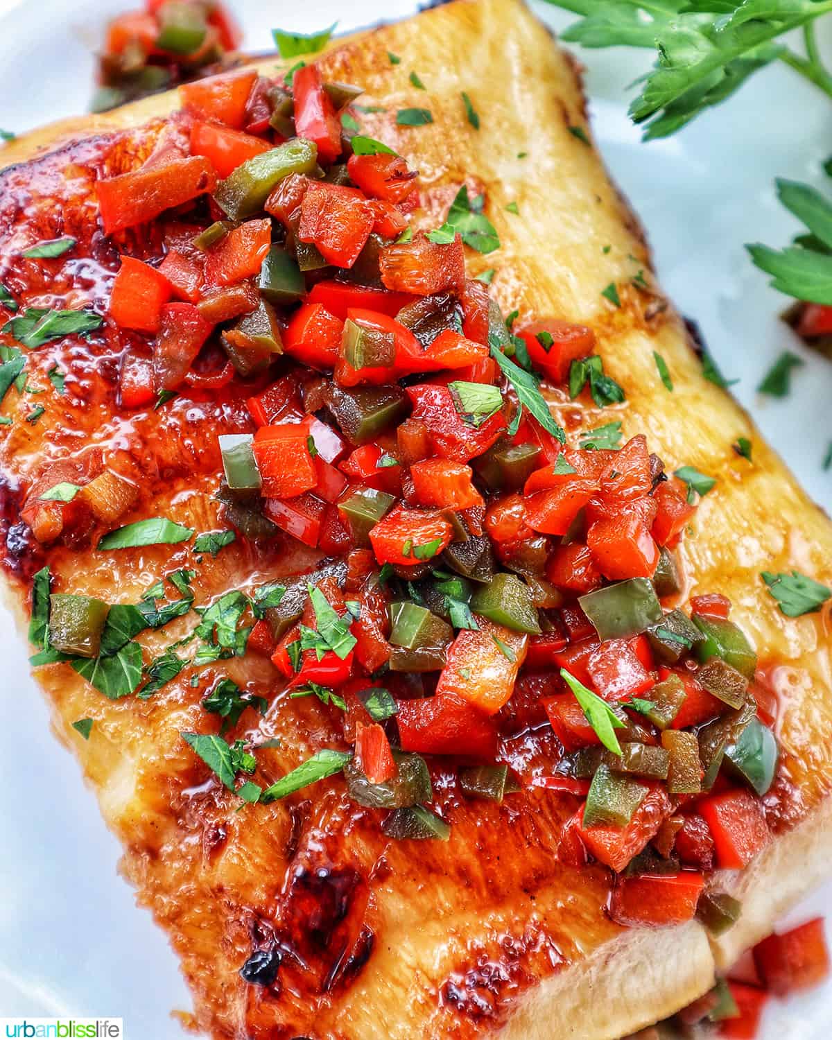 pan seared sea bass with red bell pepper and green bell pepper relish.