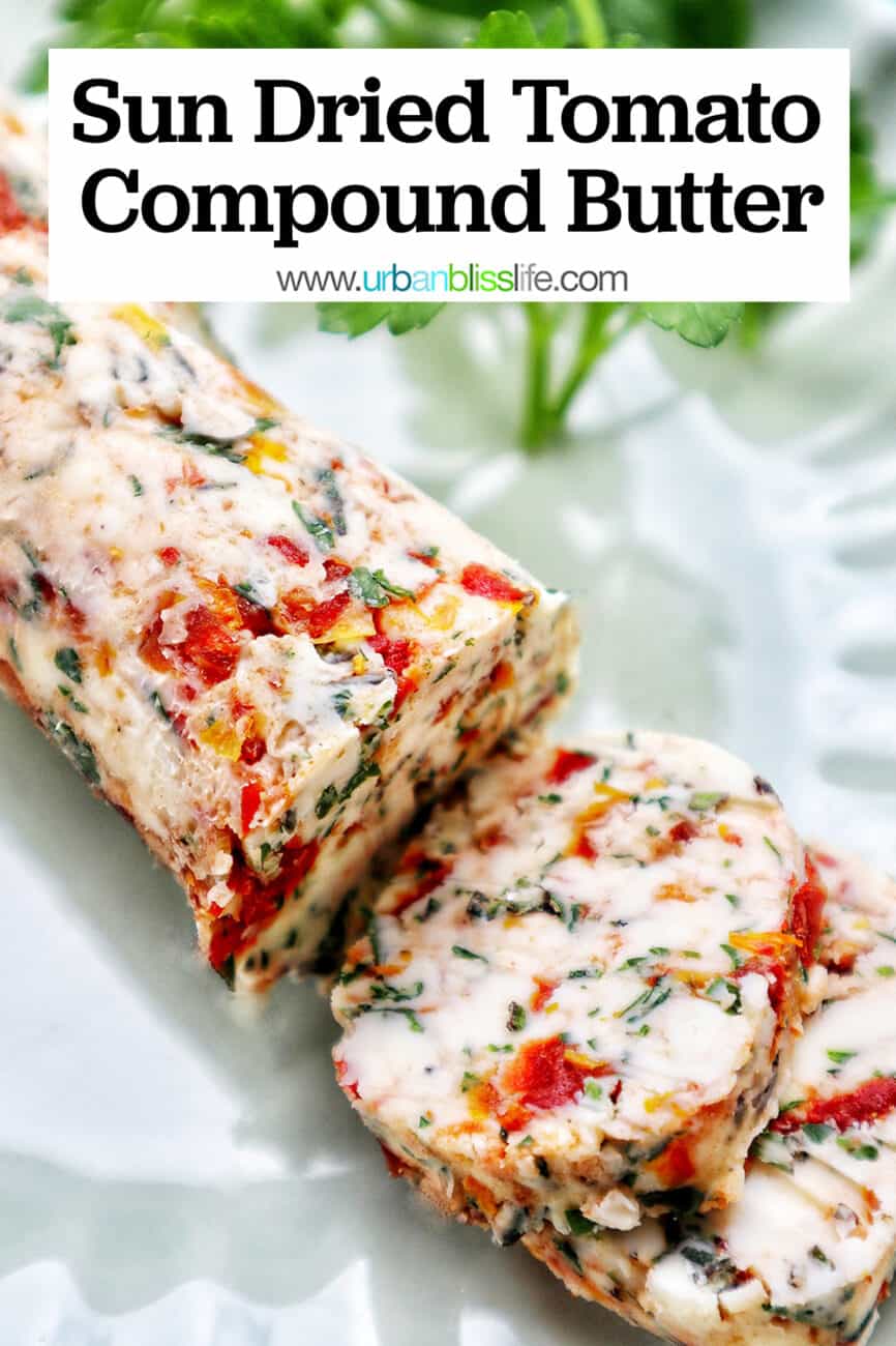 slices of sun dried tomato butter on a green plate with side of herbs.