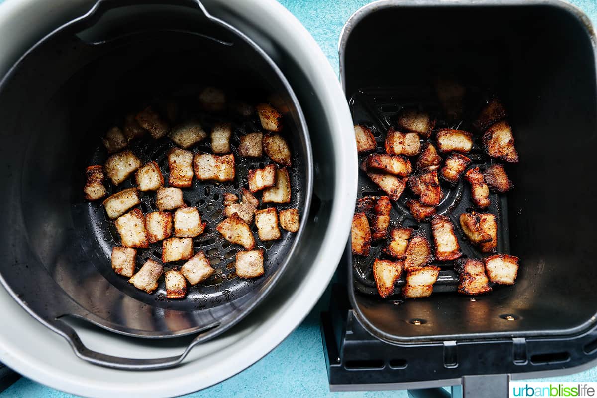 pork belly cooking in the Ninja Foodi Deluxe XL pressure cooker and in the Ninja Foodi Dual Zone air fryer side by side.