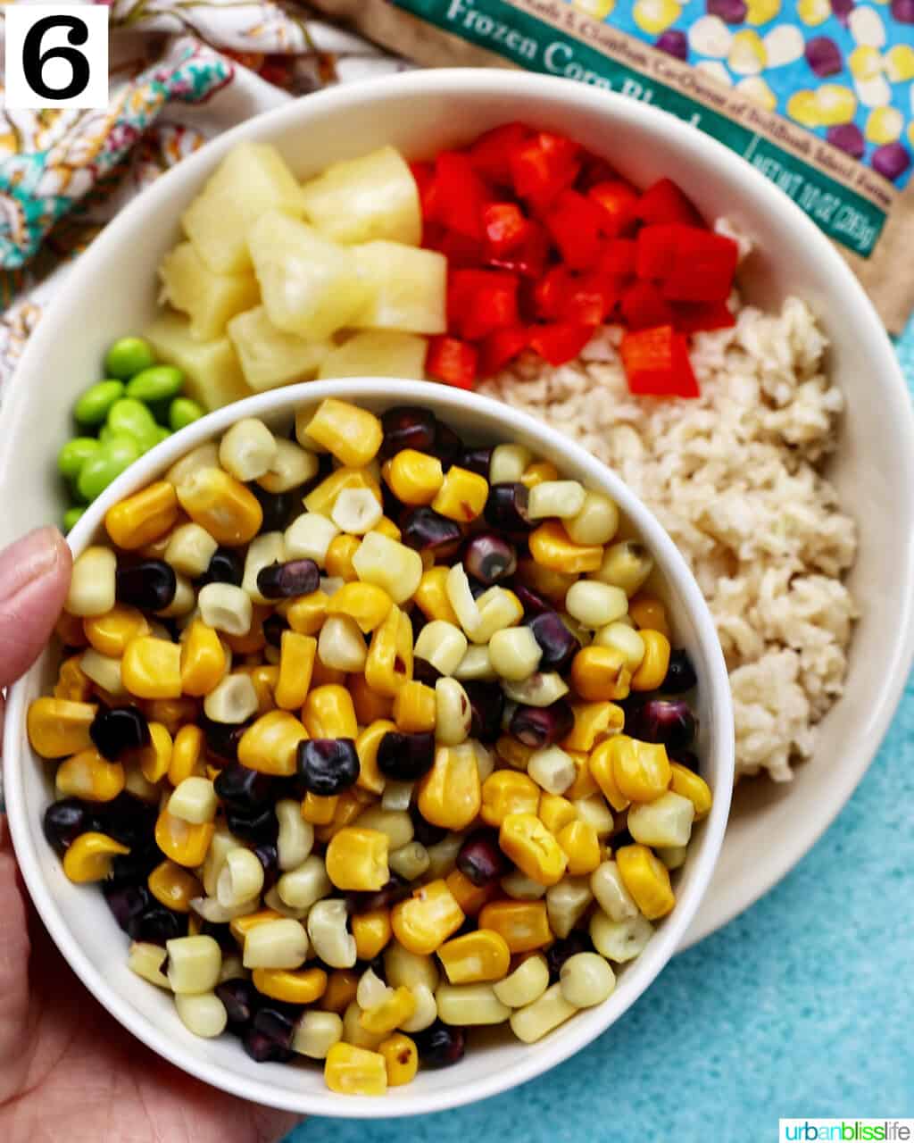 chicken teriyaki donburi bowl with brown rice, teriyaki chicken, corn, edamame, pineapple, red pepper.