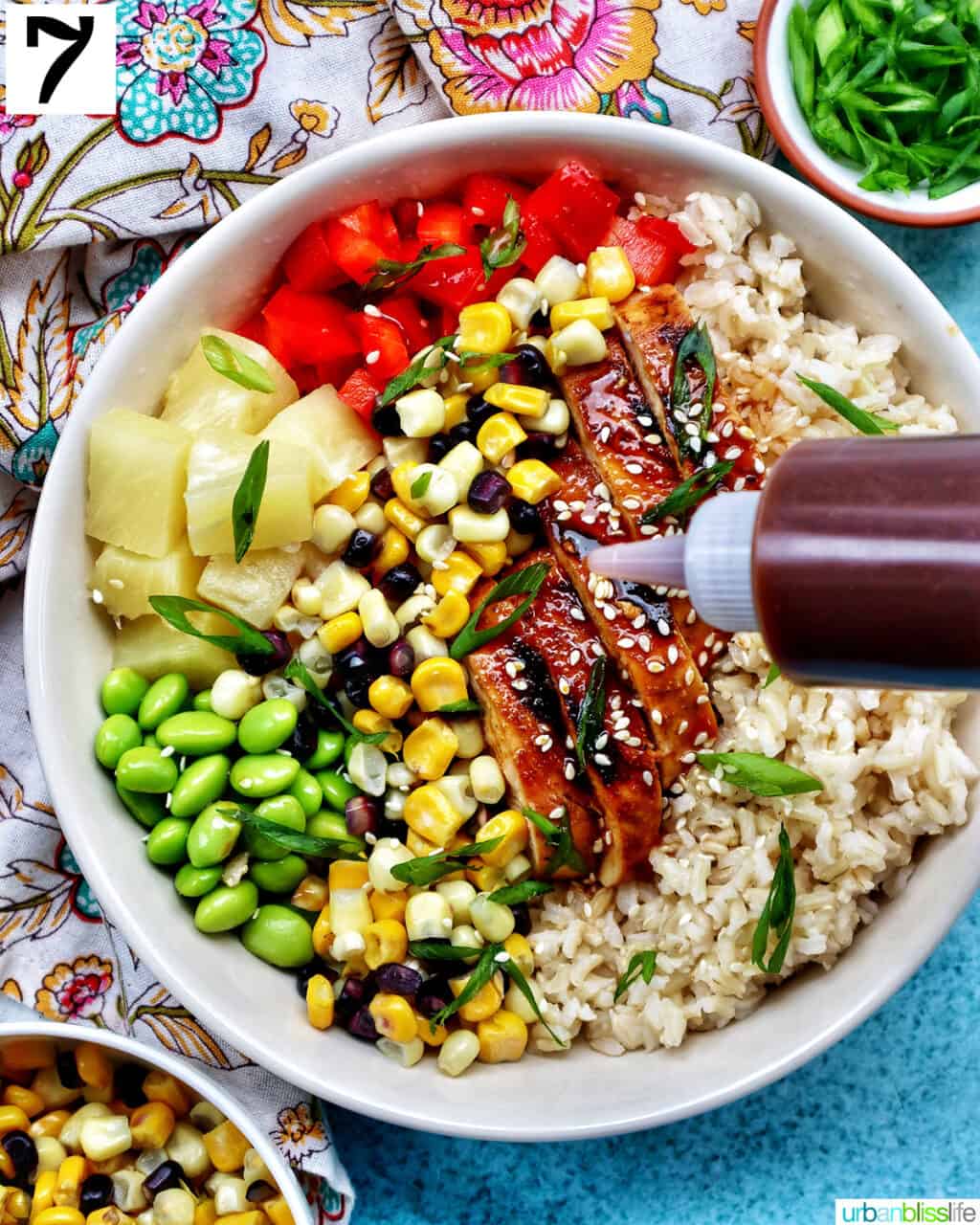 chicken teriyaki donburi bowl with brown rice, teriyaki chicken, corn, edamame, pineapple, red pepper.