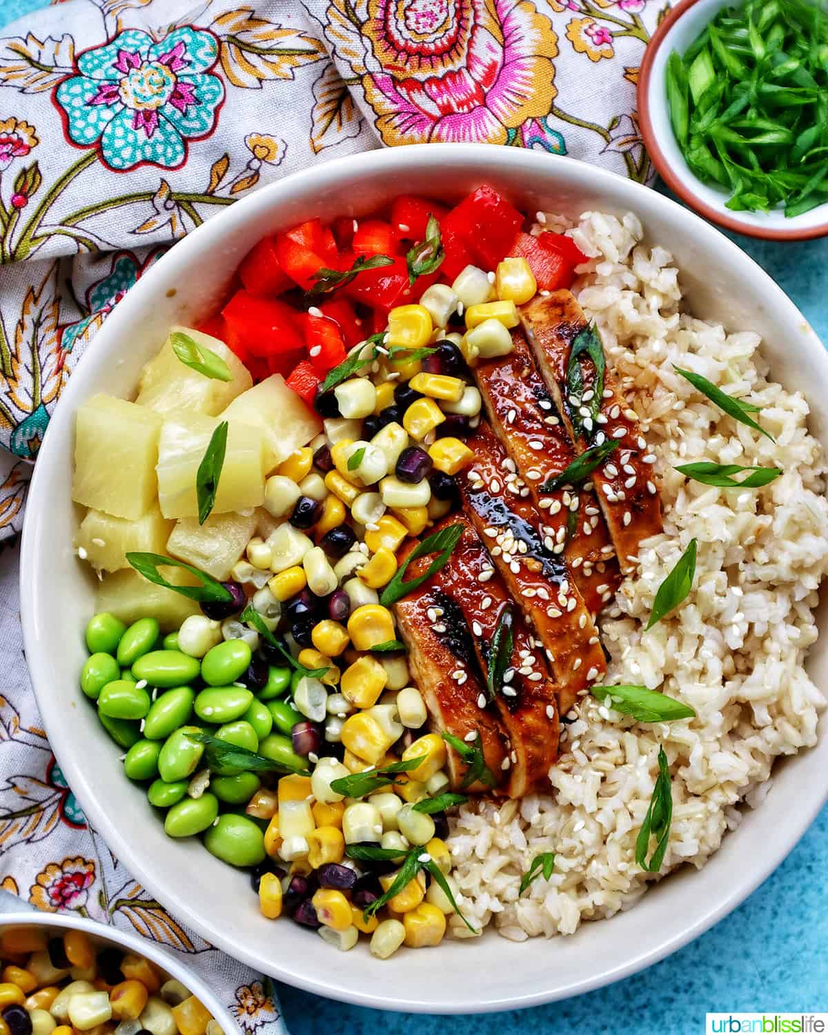 chicken teriyaki donburi bowl with brown rice, teriyaki chicken, corn, edamame, pineapple, red pepper.