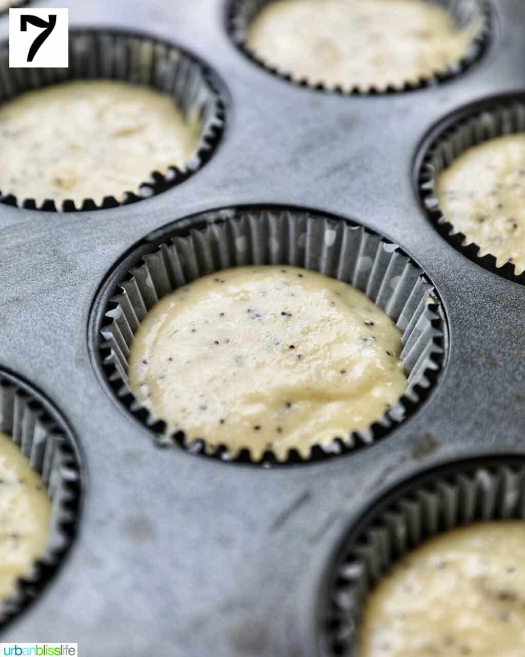 cupcake batter in a lined muffin tin.