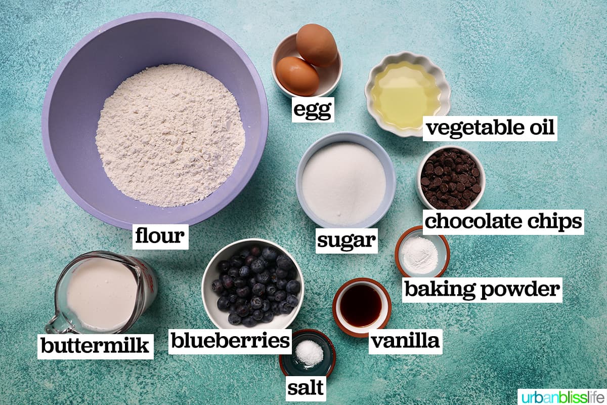 bowls of ingredients to make several blueberry chocolate chip muffins