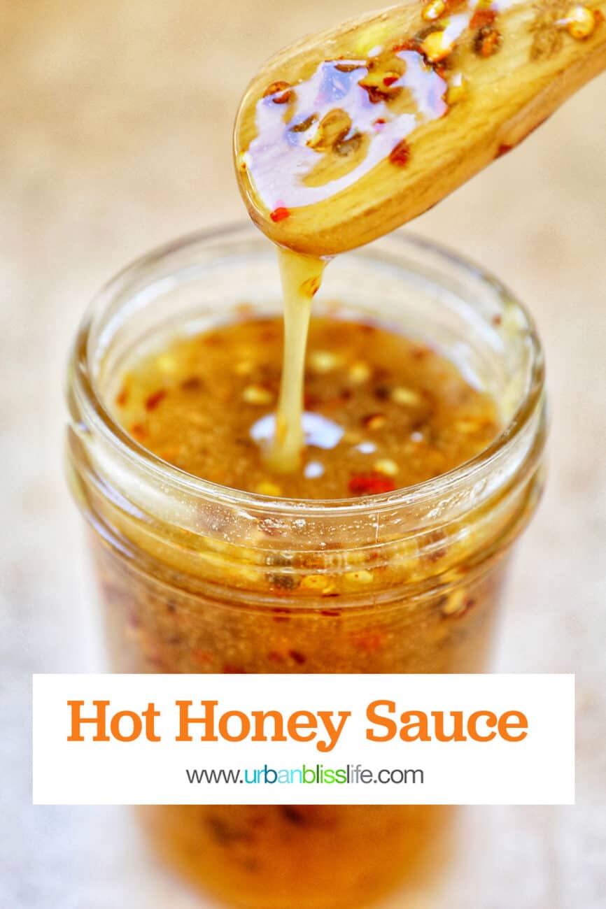 honey spoon lifting hot honey sauce out of a mason jar with title text that reads "hot honey sauce" and Urban Bliss Life logo.