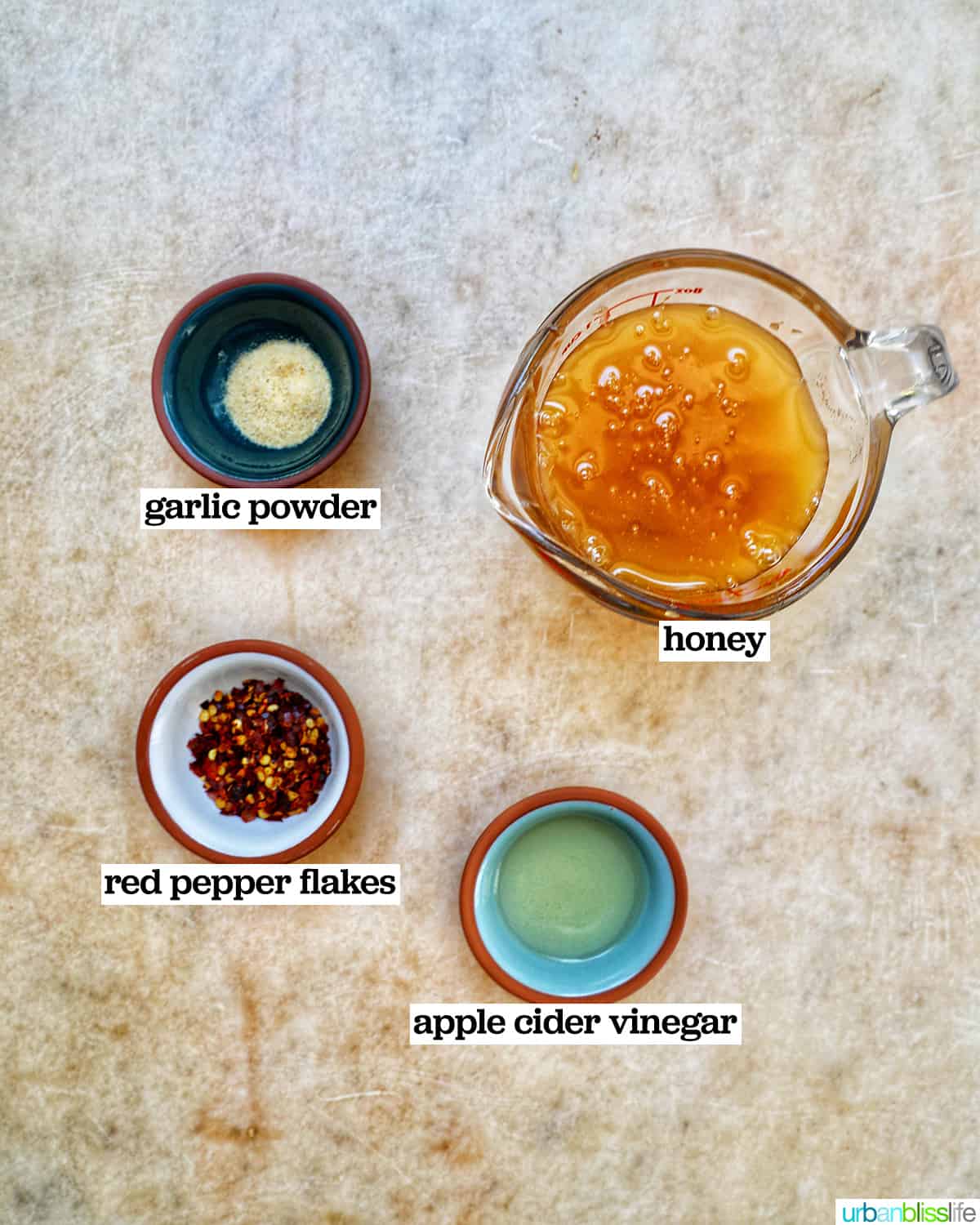 bowls of ingredients to make hot honey sauce.