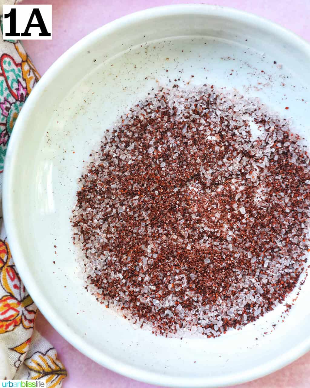 chili salt cocktail garnish in a white bowl.