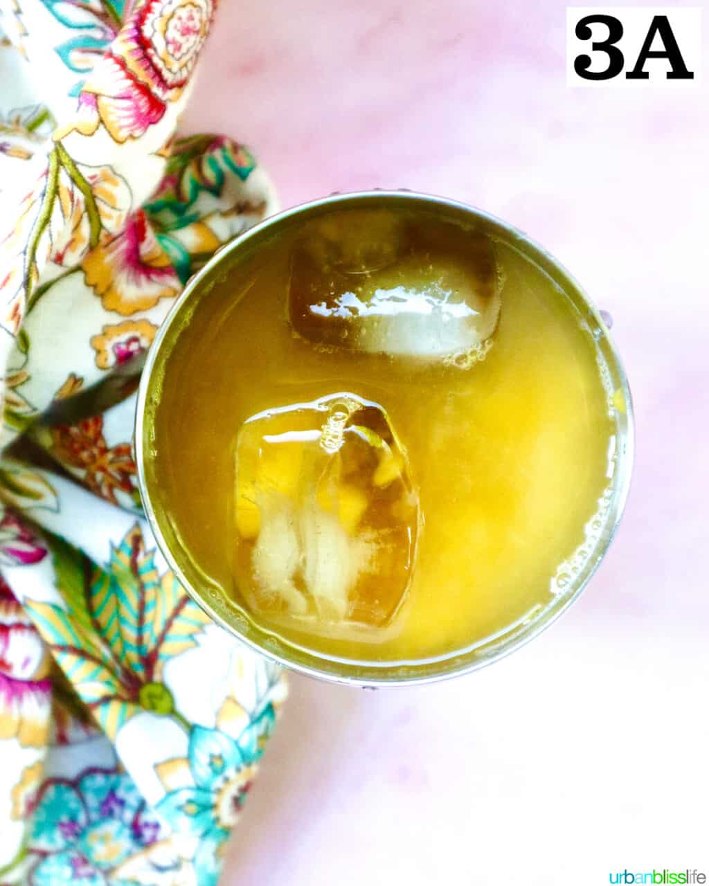 spicy mango margarita with ice in a cocktail shaker.