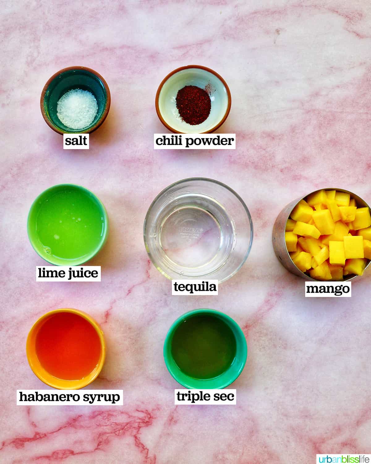 bowls of ingredients to make spicy mango margaritas.