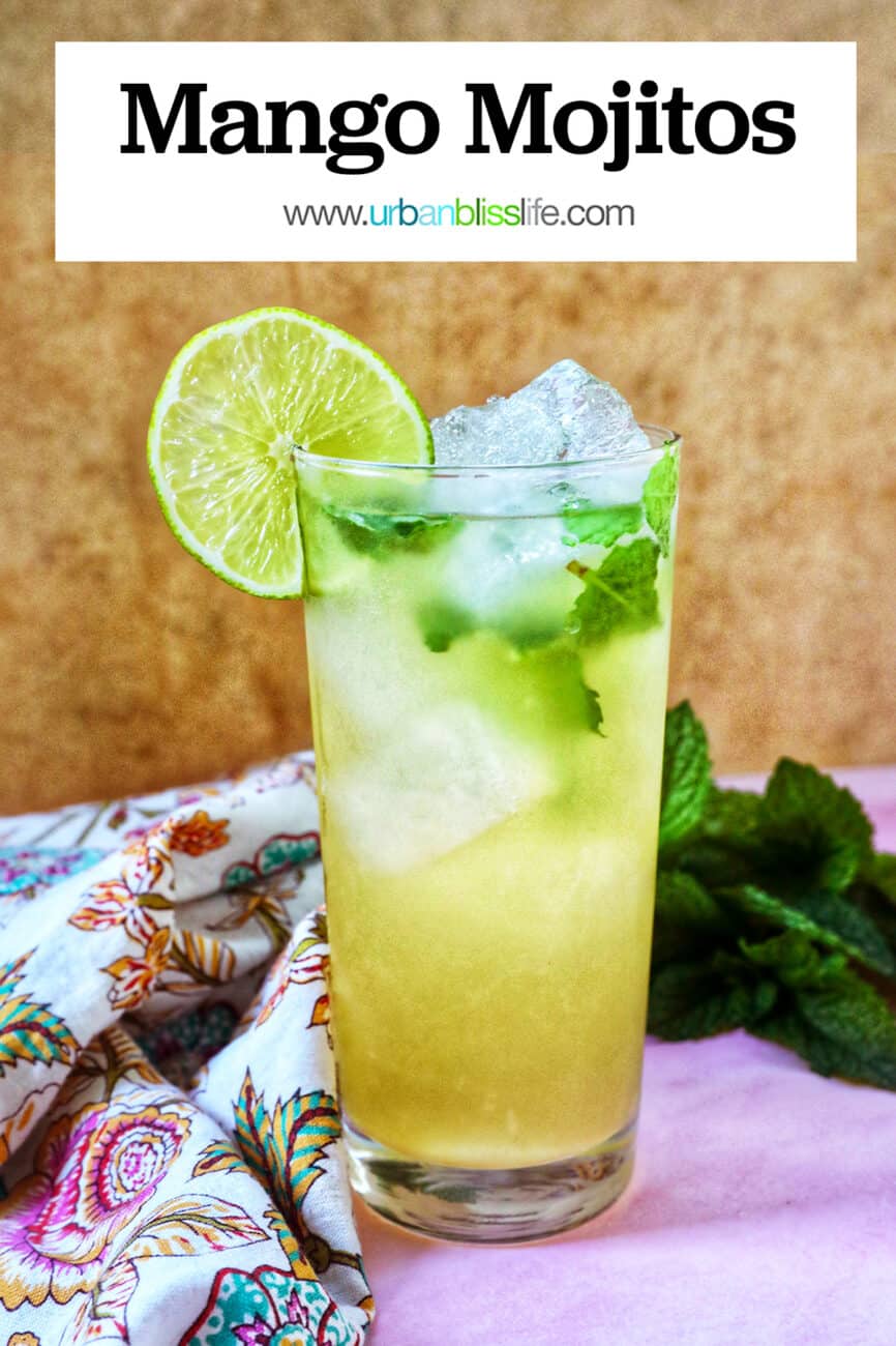Mango mojito with mint leaves, ice cubes, and a lime slice garnish.