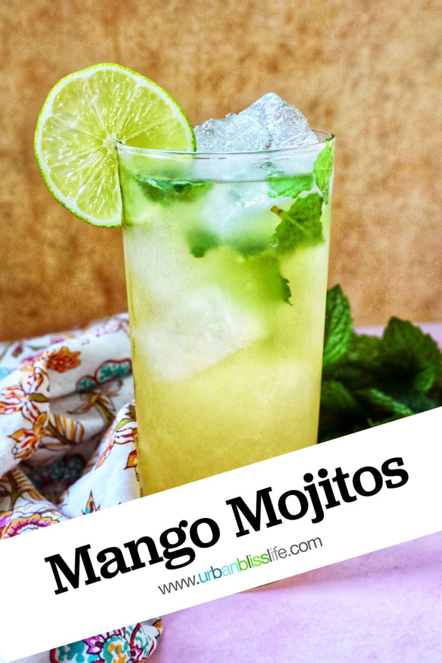 Mango mojito with mint leaves, ice cubes, and a lime slice garnish.