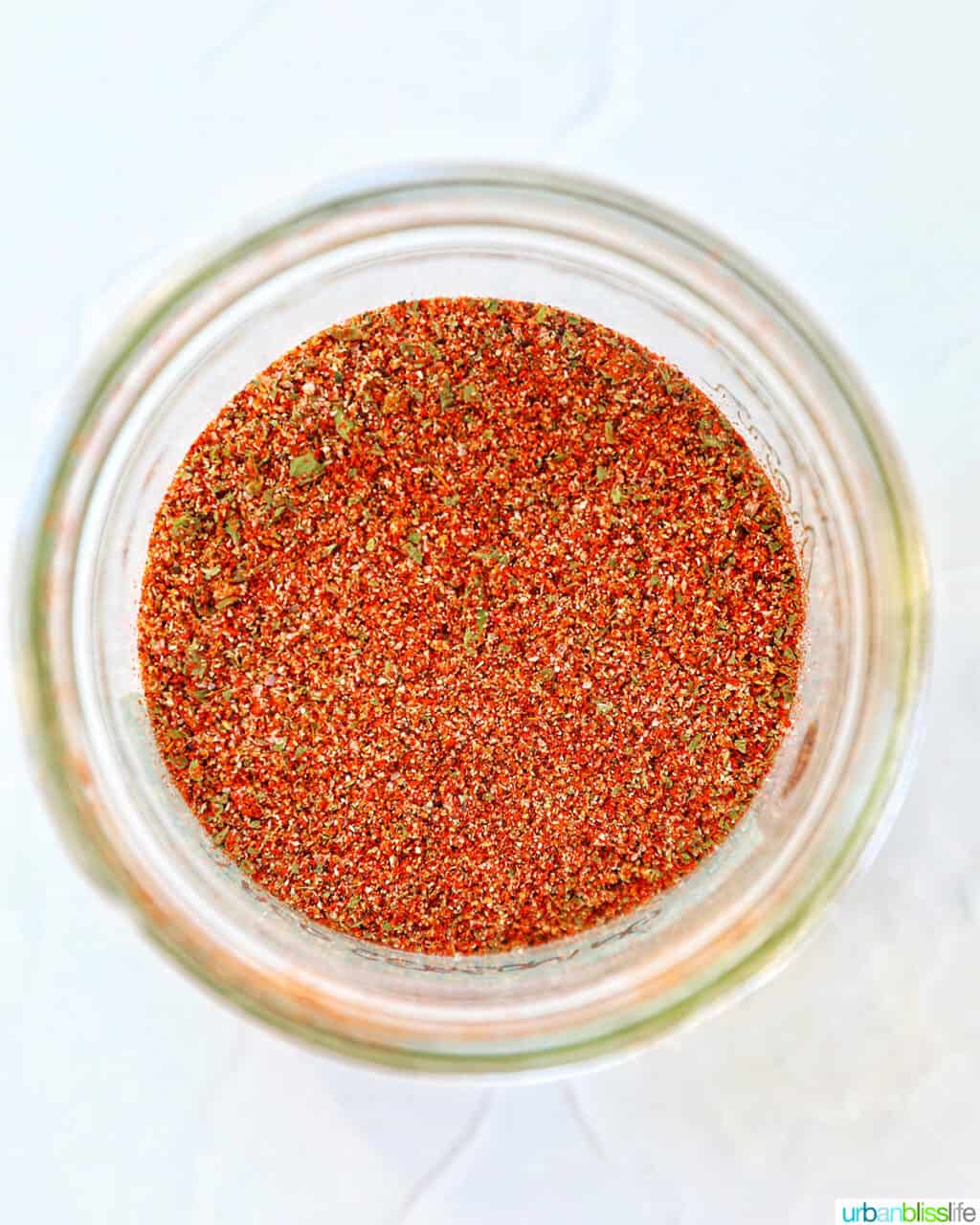 overhead looking inside a jar of homemade mild taco seasoning.