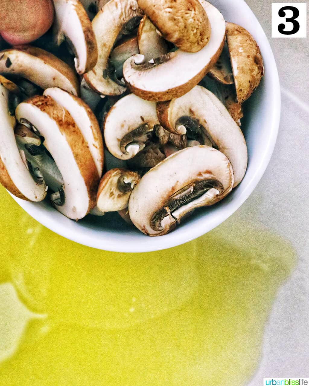 bowl of chopped mushrooms over olive oil in a pan.