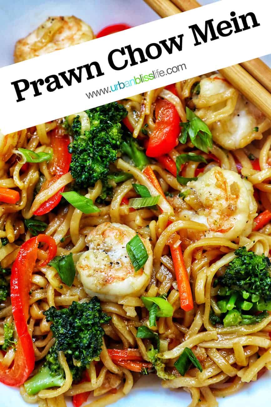 closeup of prawns, noodles, and vegetables with title text that reads "Prawn Chow Mein."