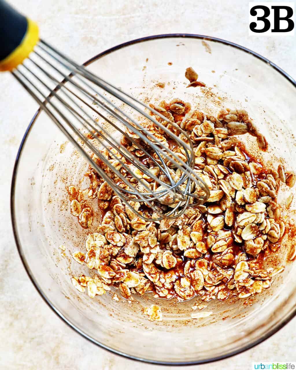 clear glass bowl with ingredients to make a cinnamon oats topping.