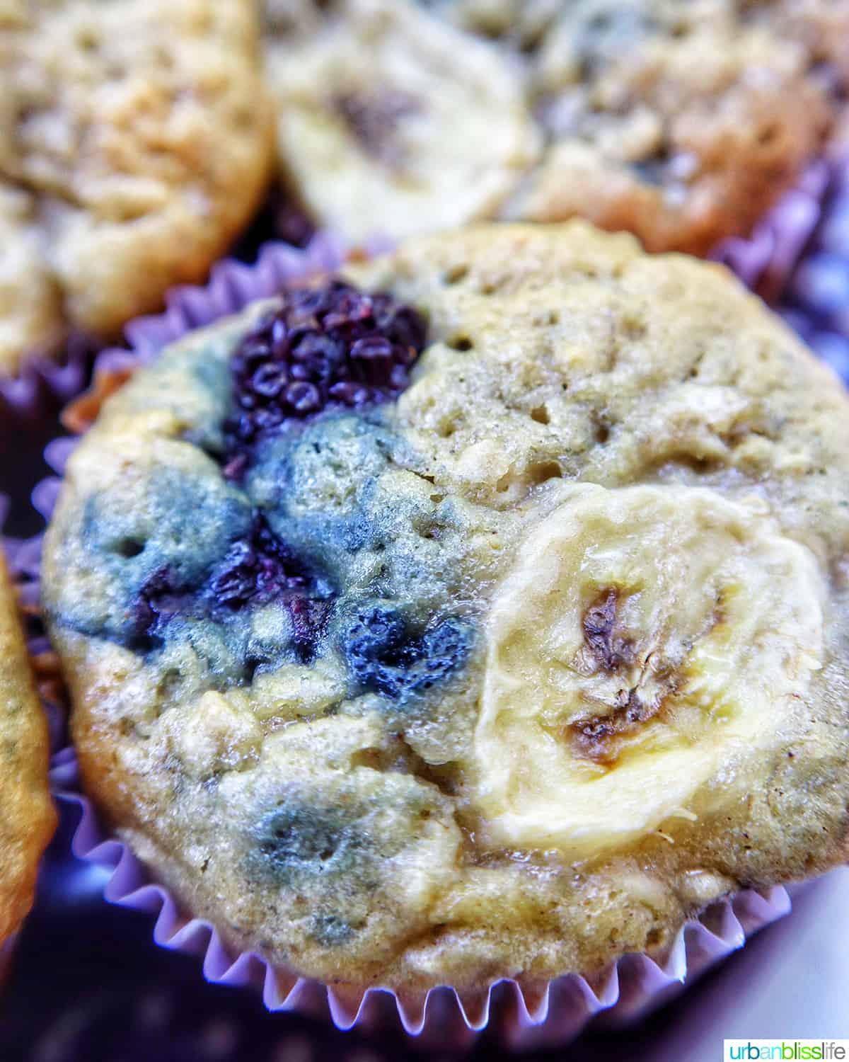 close-up of a banana blackberry oatmeal muffins.